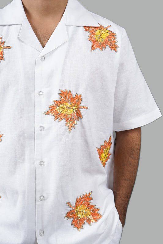 Handmade white linen blend shirt with maple leaf hand embroidery, premium embroidered casual wear for men, luxury artisanal shirt.
