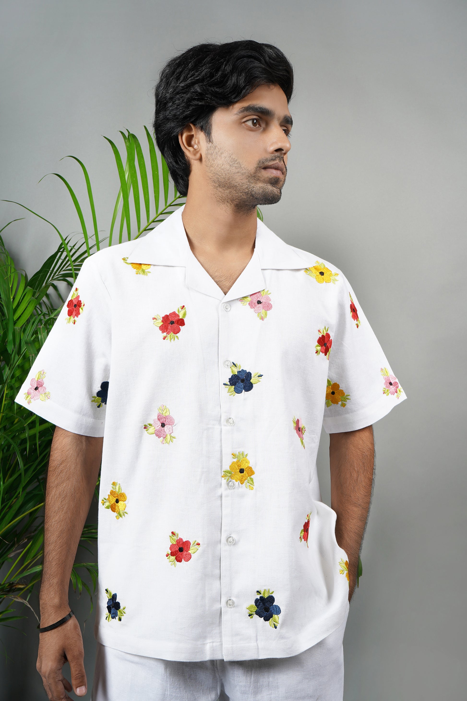 Men's premium white cotton shirt with intricate floral hand embroidery, breathable fabric, summer wear, luxury handmade fashion.