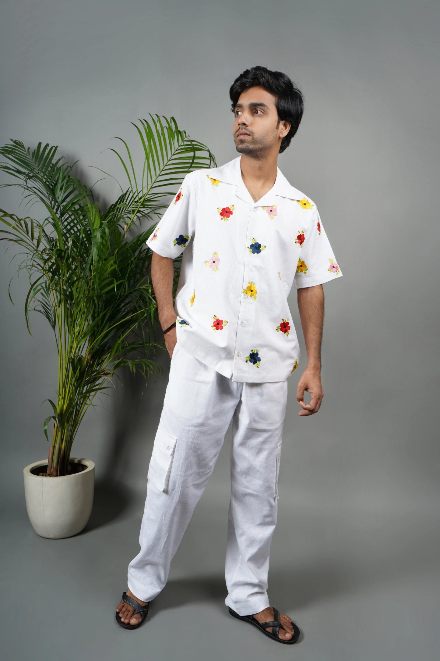  "White linen blend Cuban collar shirt for men, vibrant hand-embroidered floral design, lightweight and stylish summer essential.