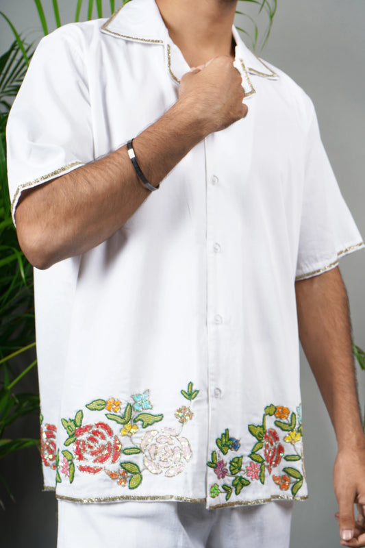 Men's premium white cotton shirt with intricate floral hand embroidery, breathable fabric, summer wear, luxury handmade fashion.