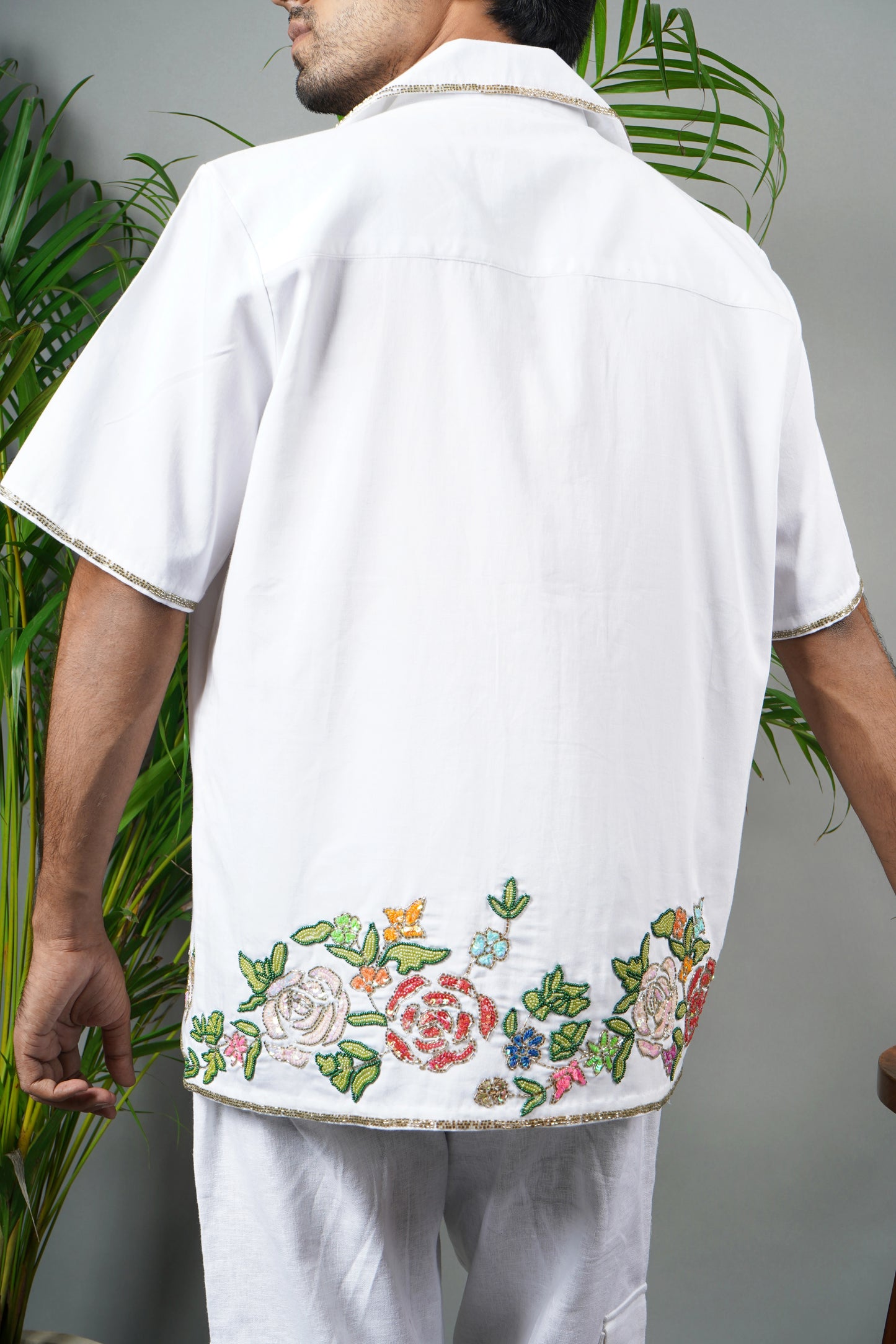 Men's premium white cotton shirt with intricate floral hand embroidery, breathable fabric, summer wear, luxury handmade fashion.