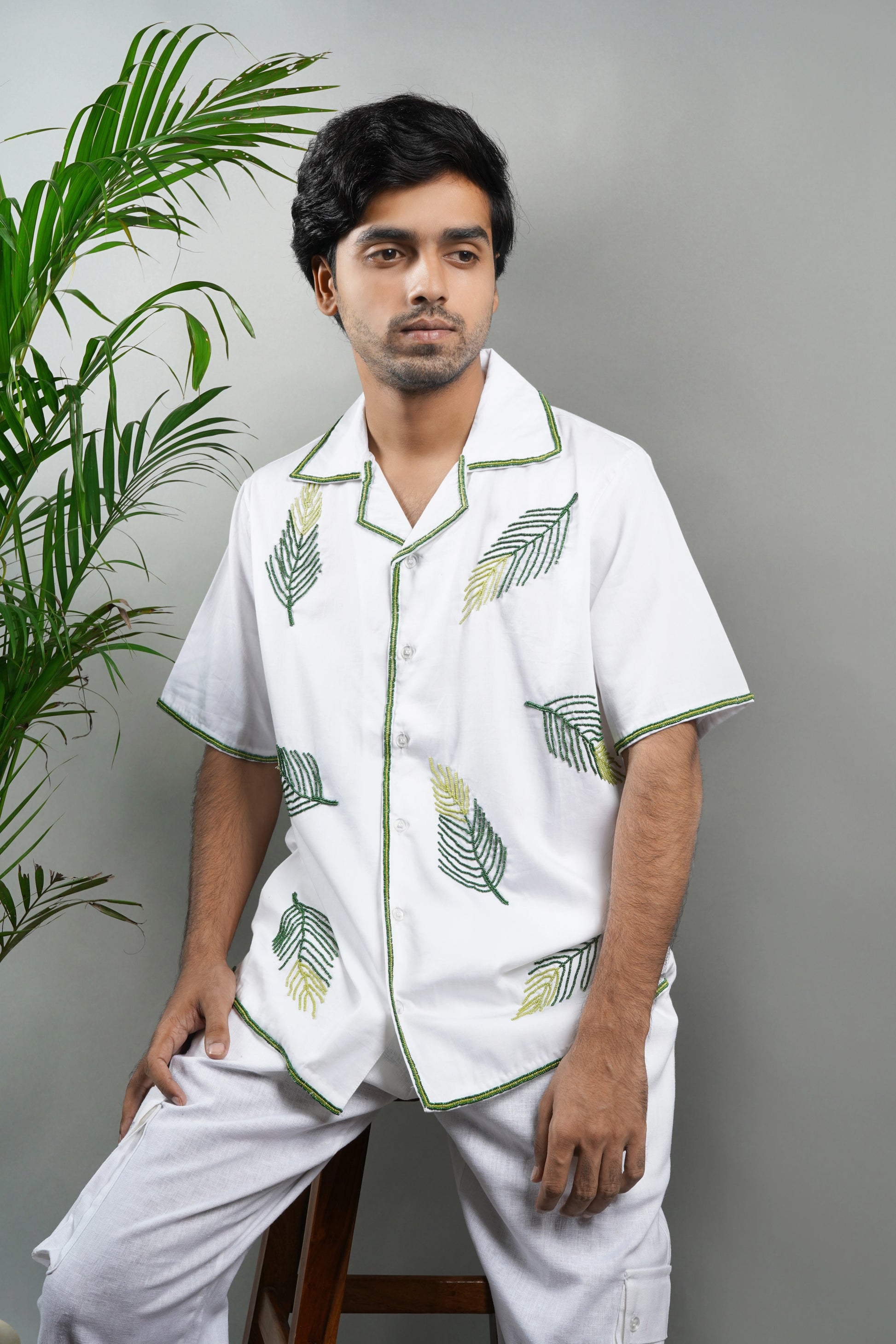 Handmade embroidered white Cuban collar shirt with green leaf patterns