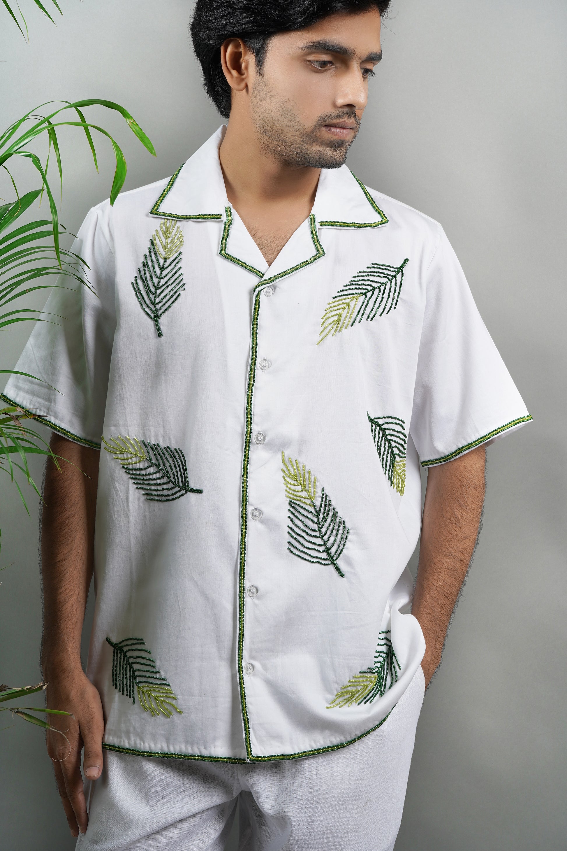 Handmade embroidered white Cuban collar shirt with green leaf patterns