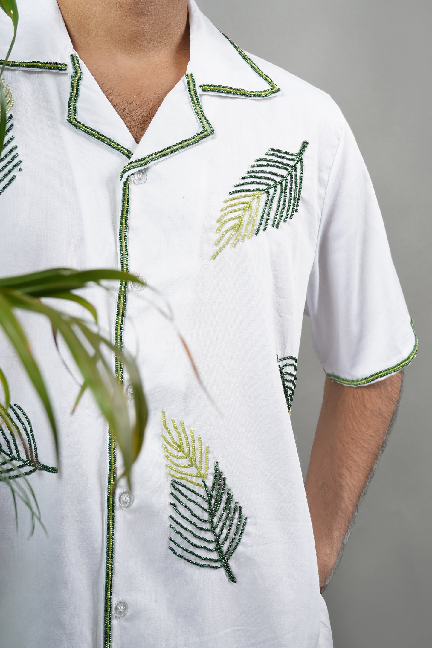 Handmade embroidered white Cuban collar shirt with green leaf patterns