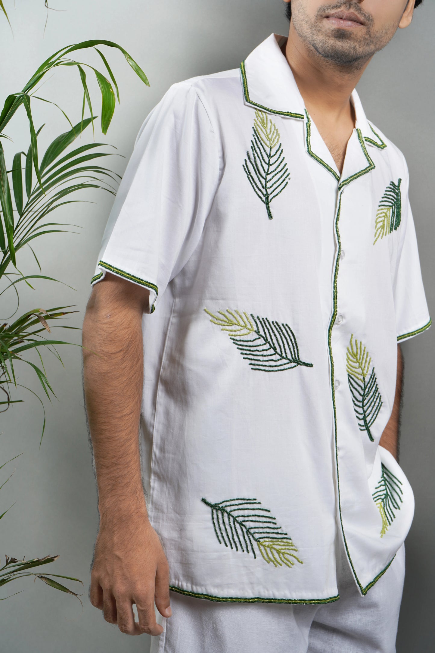 Handmade embroidered white Cuban collar shirt with green leaf patterns