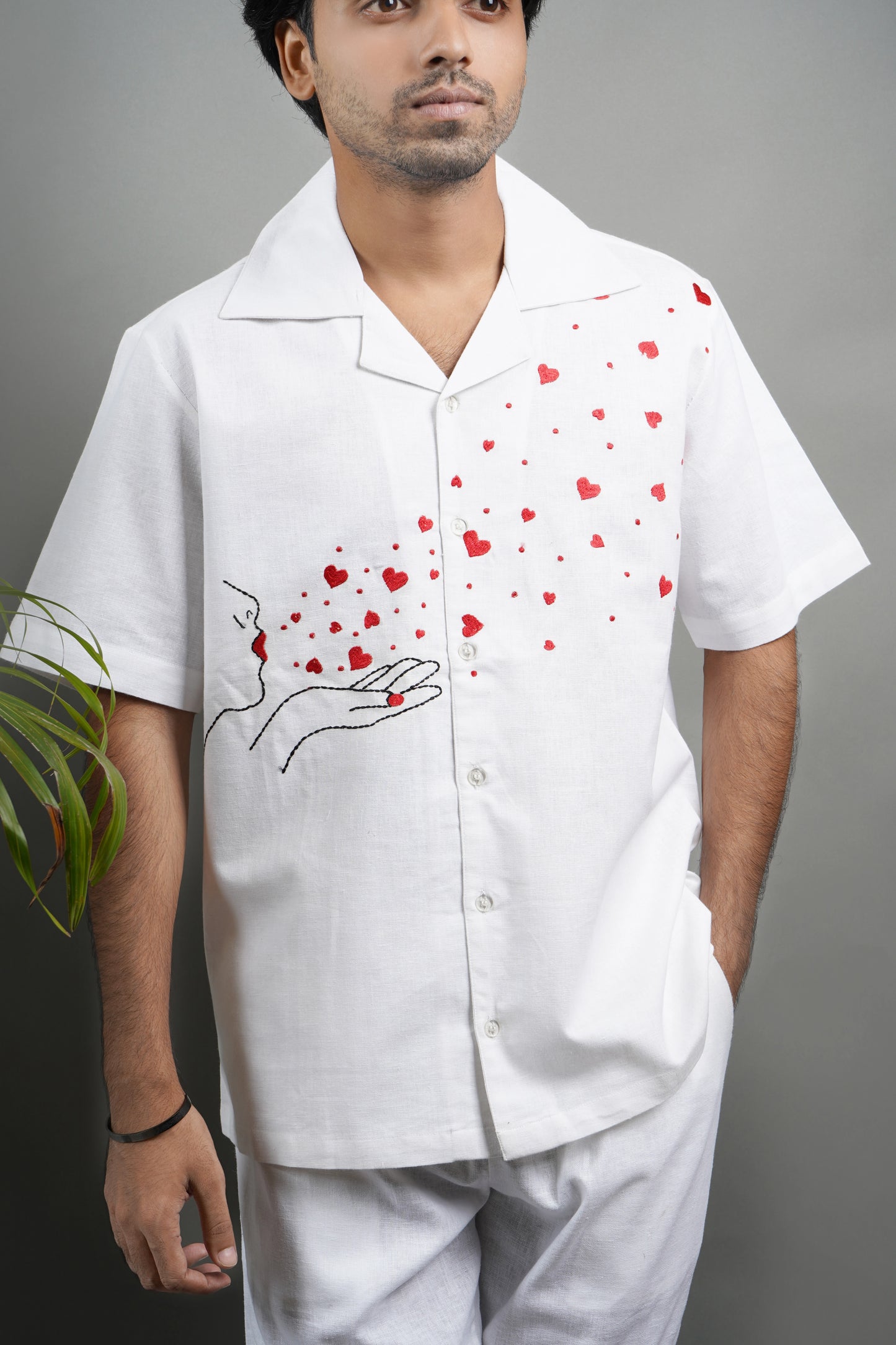 Handmade linen blend white shirt for men featuring red heart embroidery, artistic design, and luxury breathable material.