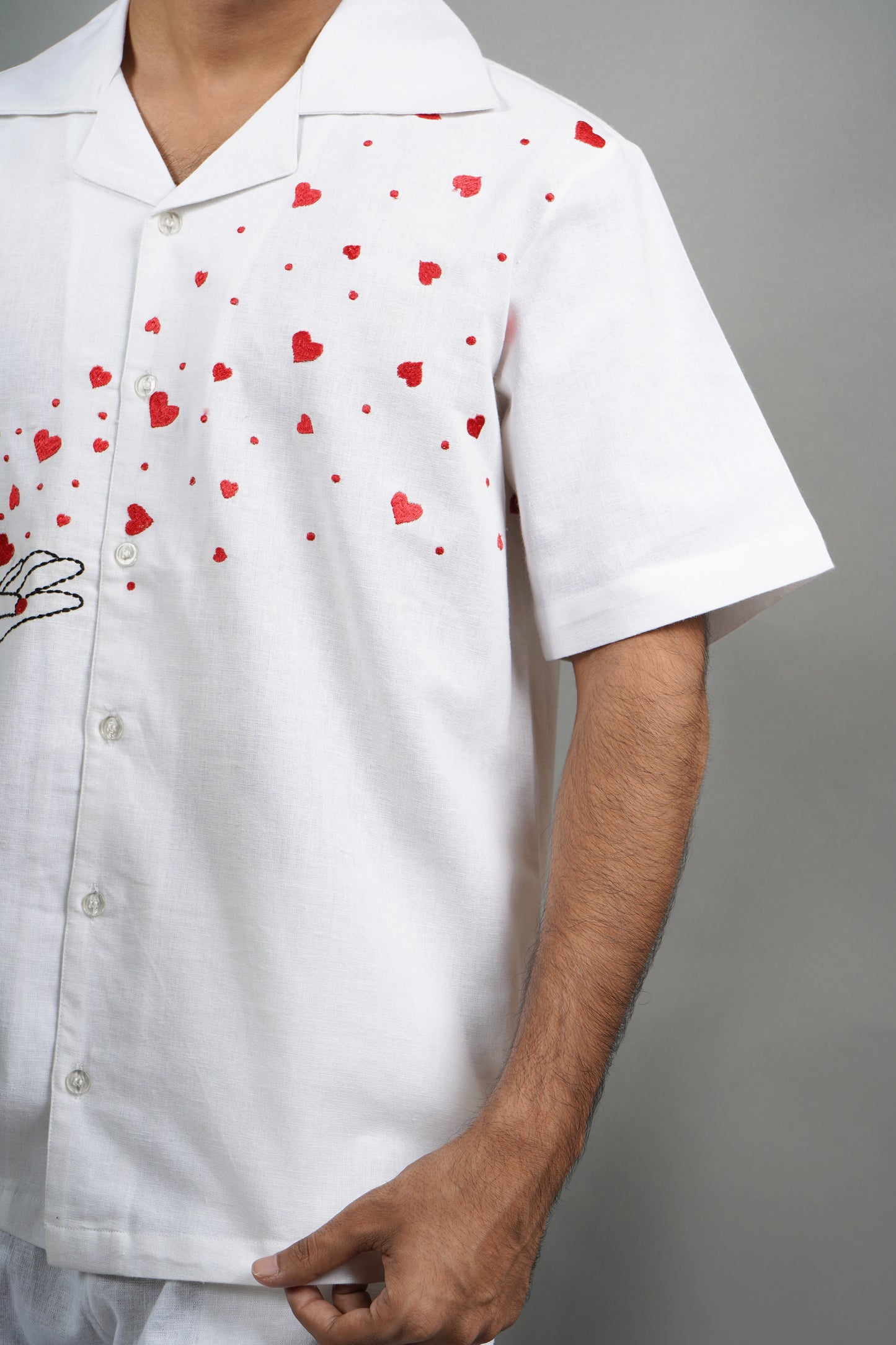 Handmade linen blend white shirt for men featuring red heart embroidery, artistic design, and luxury breathable material.