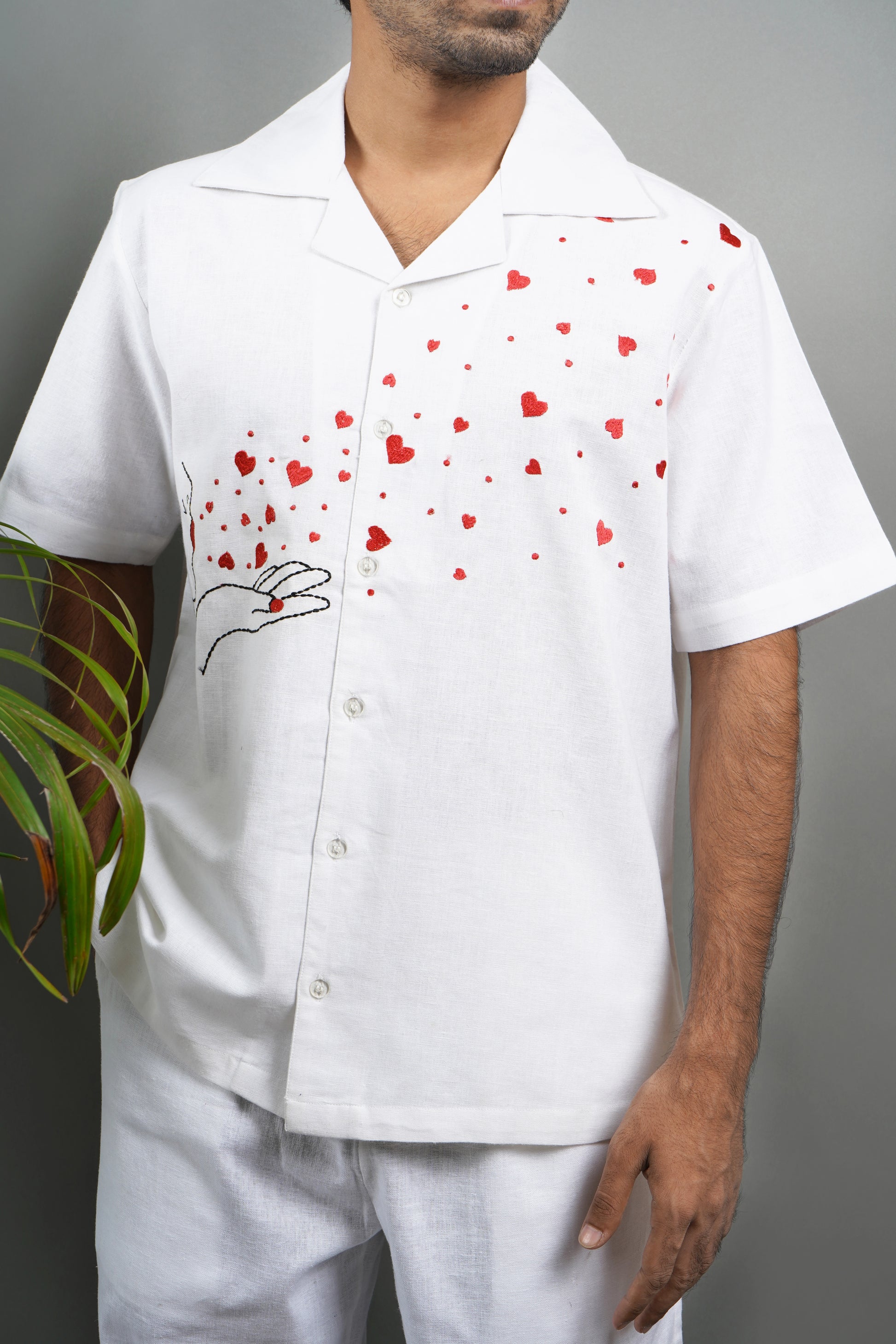 Handmade linen blend white shirt for men featuring red heart embroidery, artistic design, and luxury breathable material.