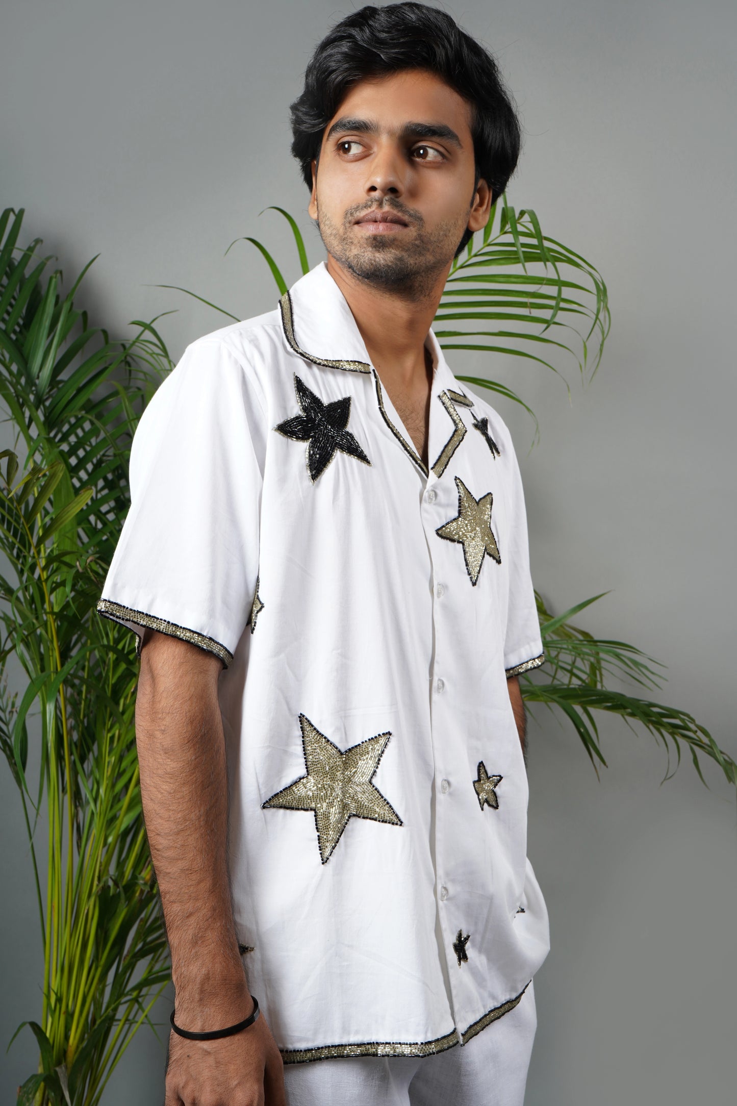 Handmade white cotton shirt with bold star pattern hand embroidery, premium embroidered men's fashion, luxury summer statement wear.