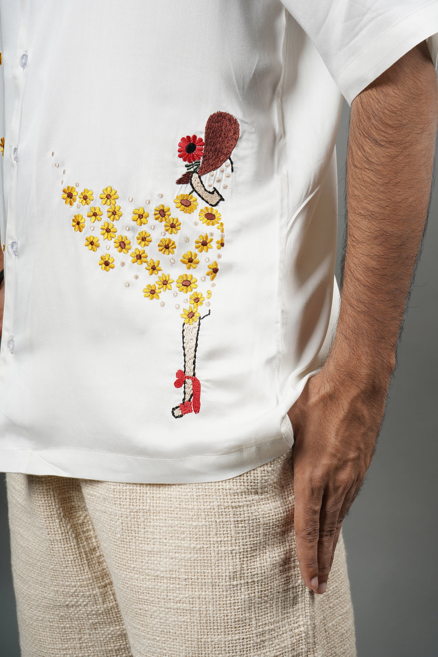 Handmade white modal shirt with delicate yellow floral embroidery, premium soft fabric, summer wear, luxury embroidered shirt for men.

