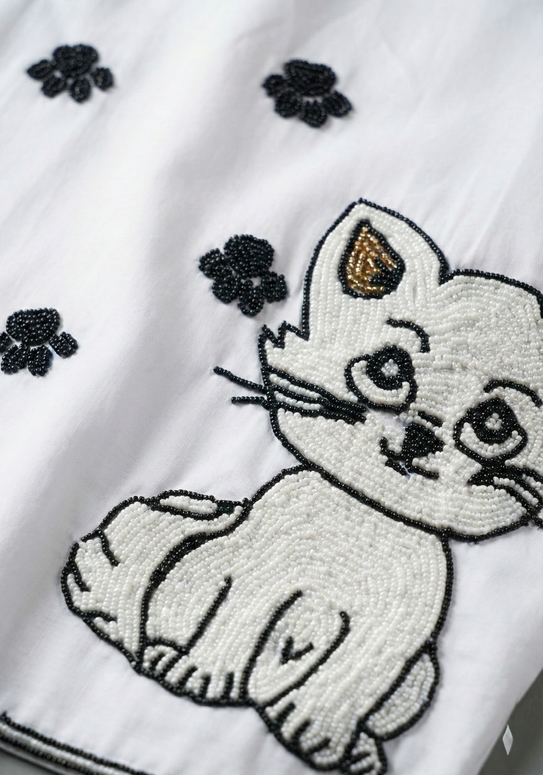 Hand embroidered cat design with paw prints on white cotton shirt, detailed beadwork cat embroidery on mens Cuban collar summer shirt