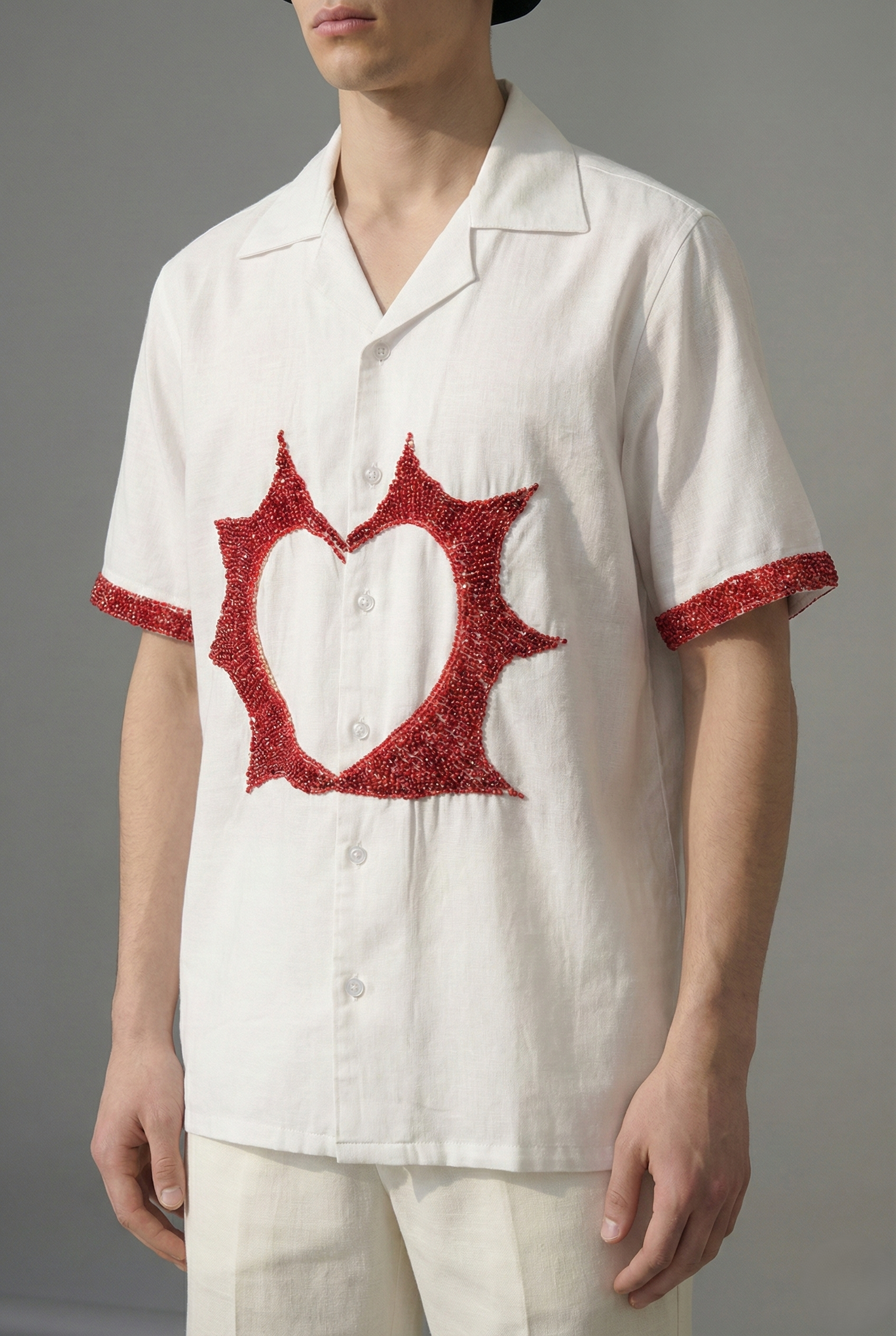 Close up red bead heart embroidery on cotton linen Cuban collar shirt