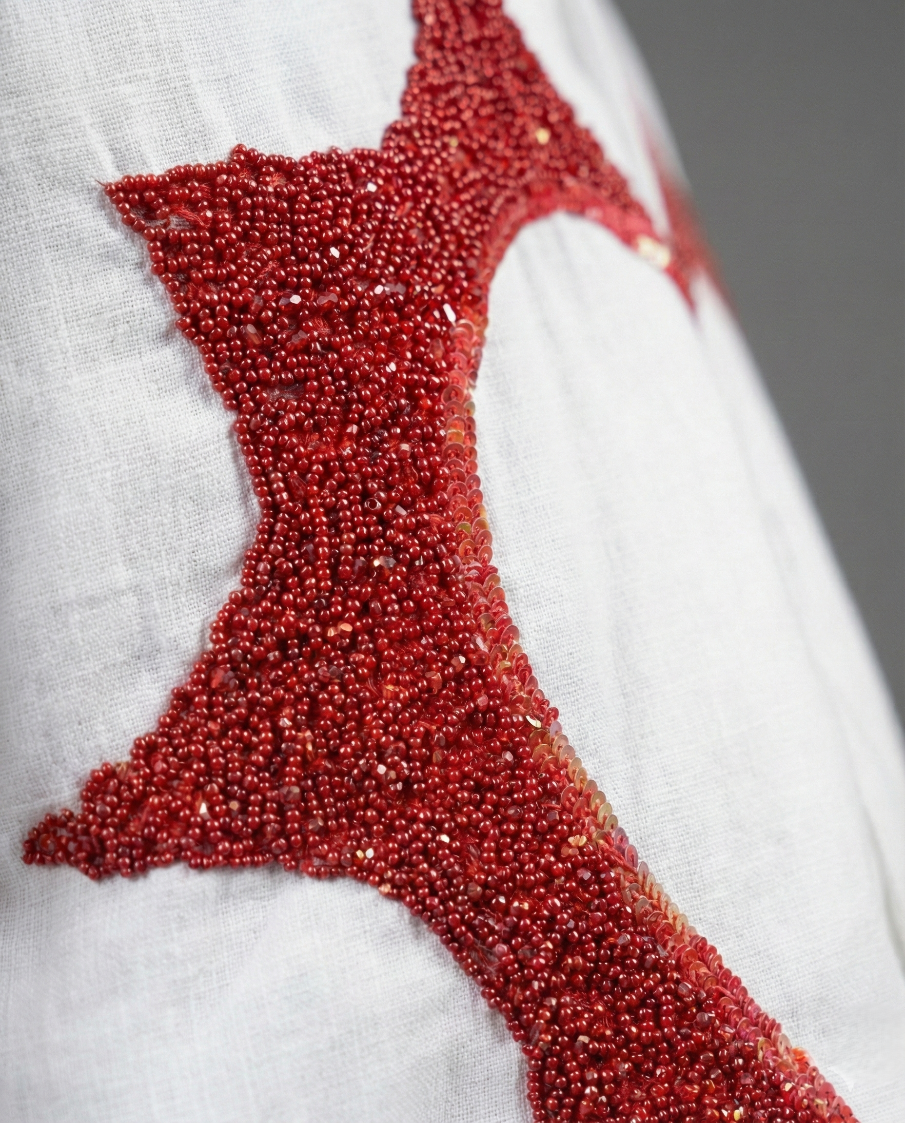 Close up red bead heart embroidery on cotton linen Cuban collar shirt