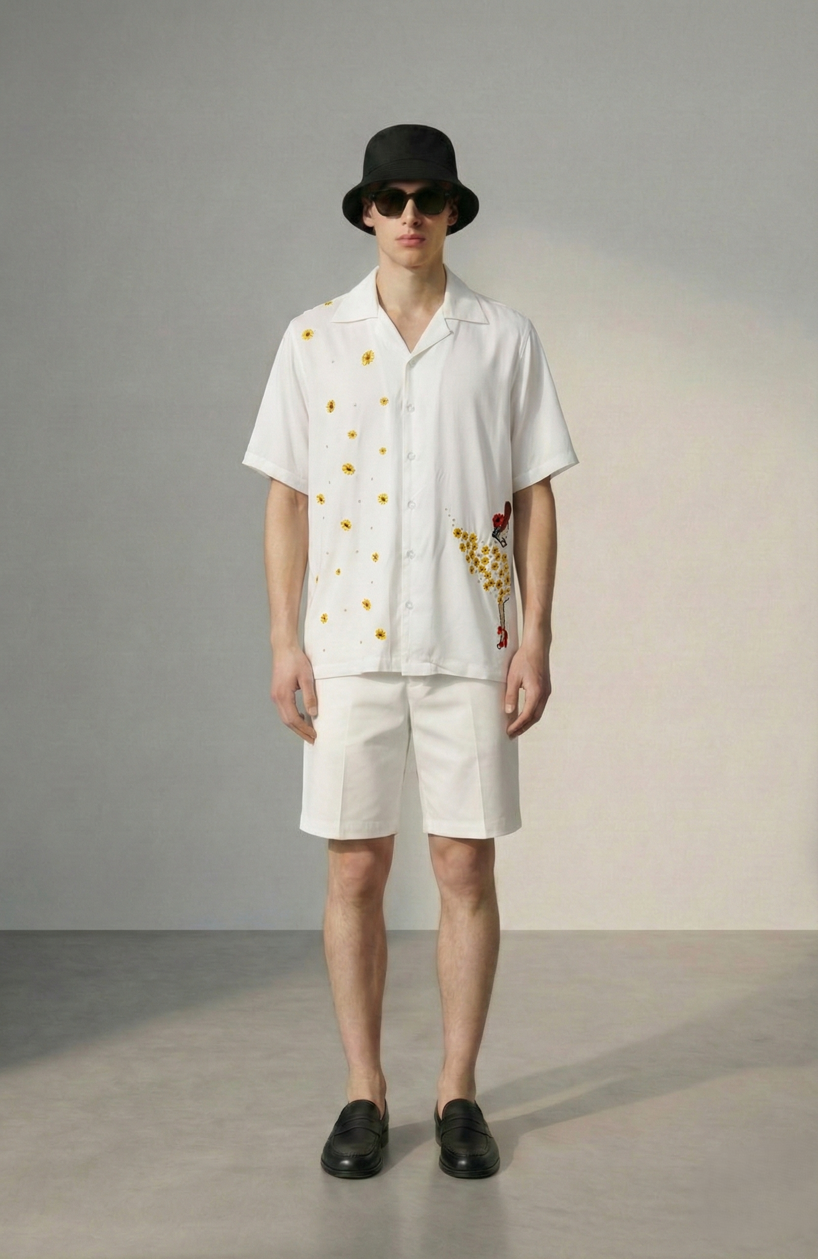 Front view of mens handmade sunflower embroidered white Cuban collar summer resort shirt with shorts