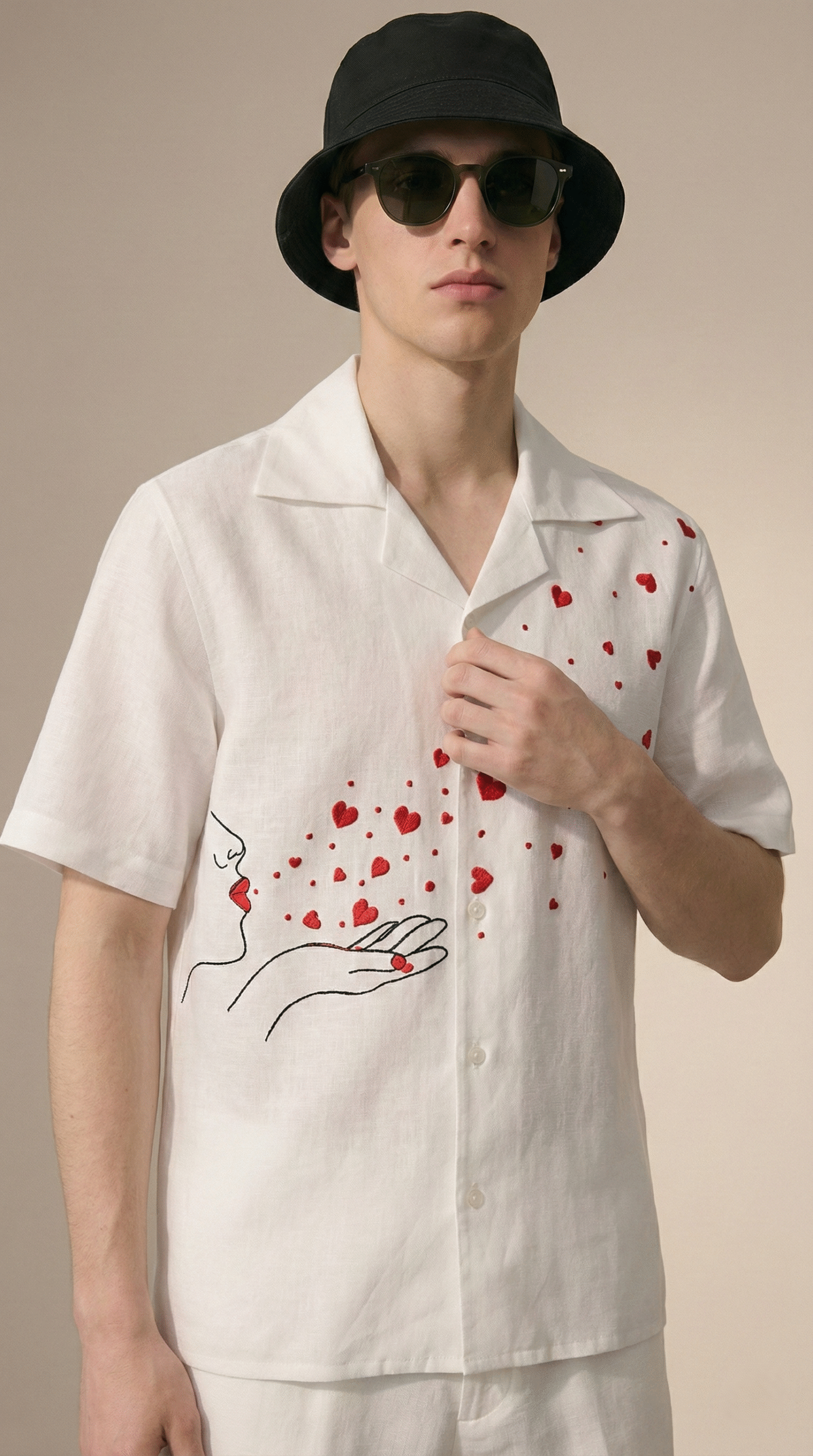 Close up of red heart embroidery and artistic line illustration on white Cuban collar cotton shirt, handmade romantic embroidery detail