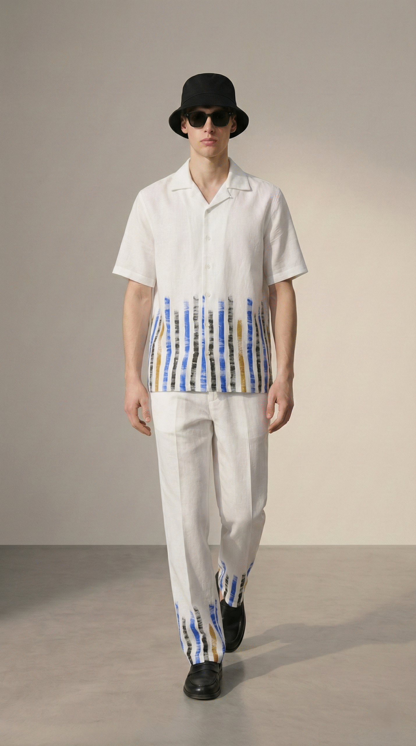 Man walking wearing white cotton linen Cuban collar shirt and striped pajama pants, stylish summer resort wear set for men