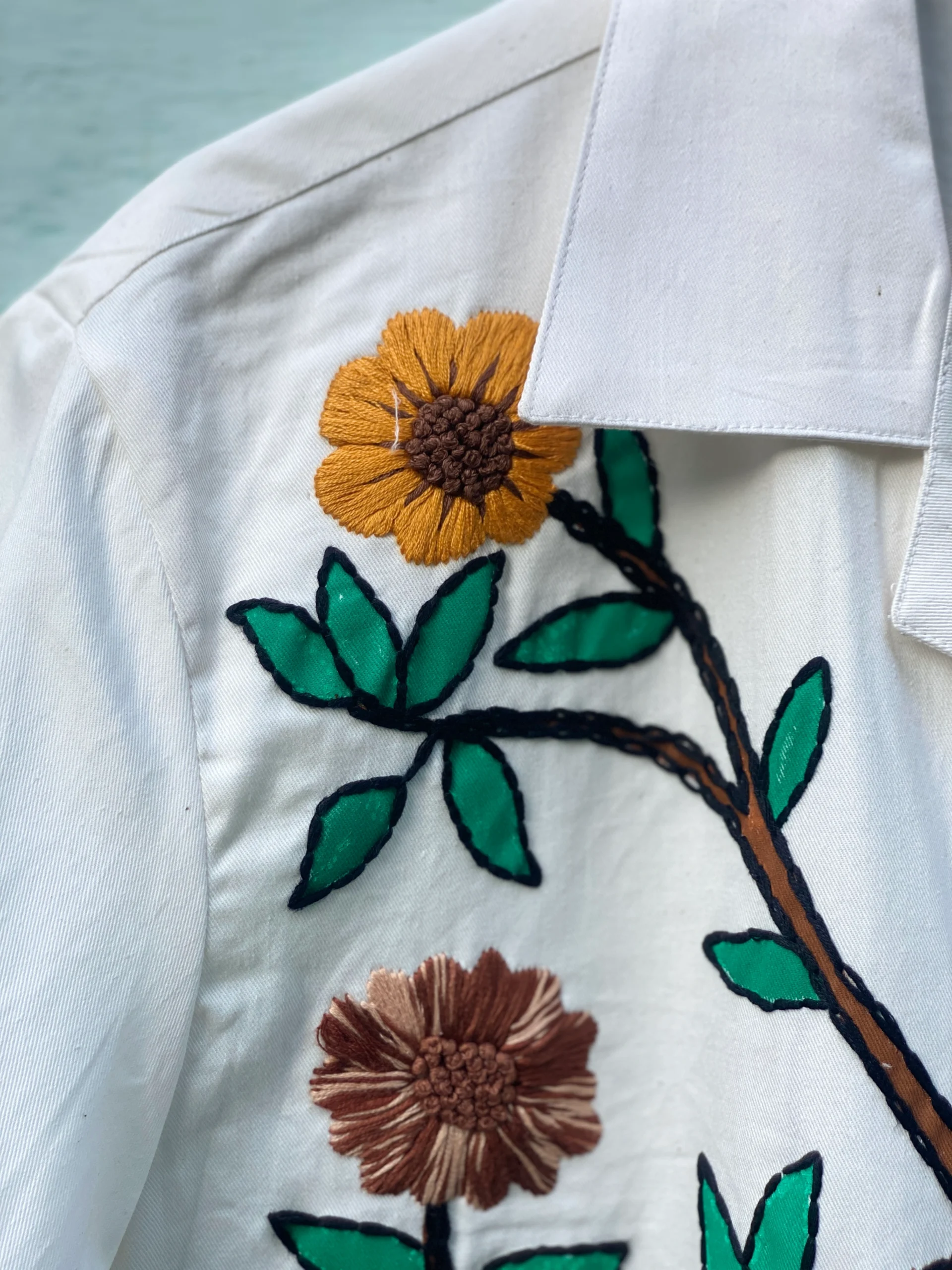 "Handmade cotton shirt with floral and tree design, crafted with hand embroidery, thread work, and fabric paint – limited edition Cuban collar shirt by Liibula"