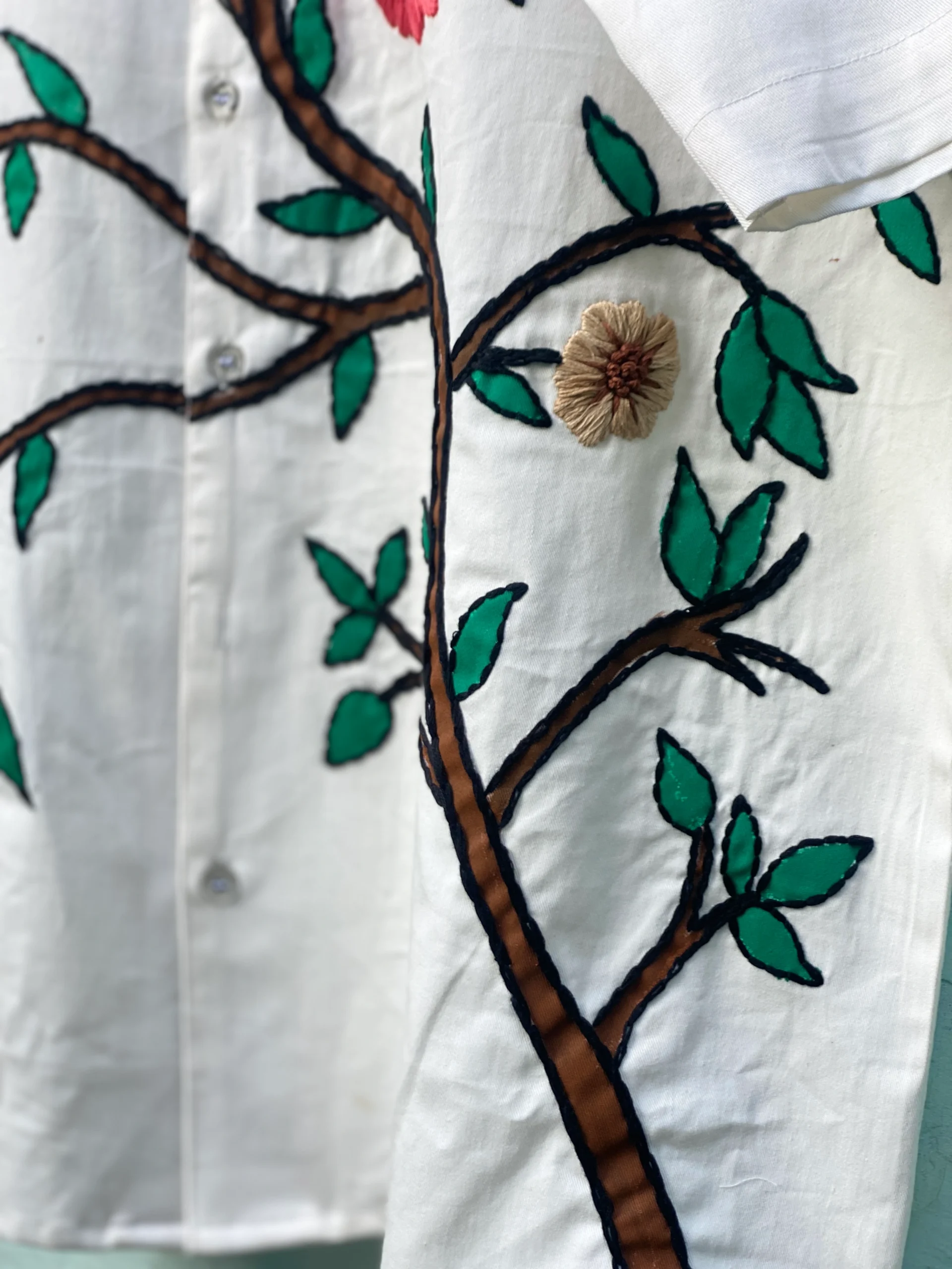"Handmade cotton shirt with floral and tree design, crafted with hand embroidery, thread work, and fabric paint – limited edition Cuban collar shirt by Liibula"