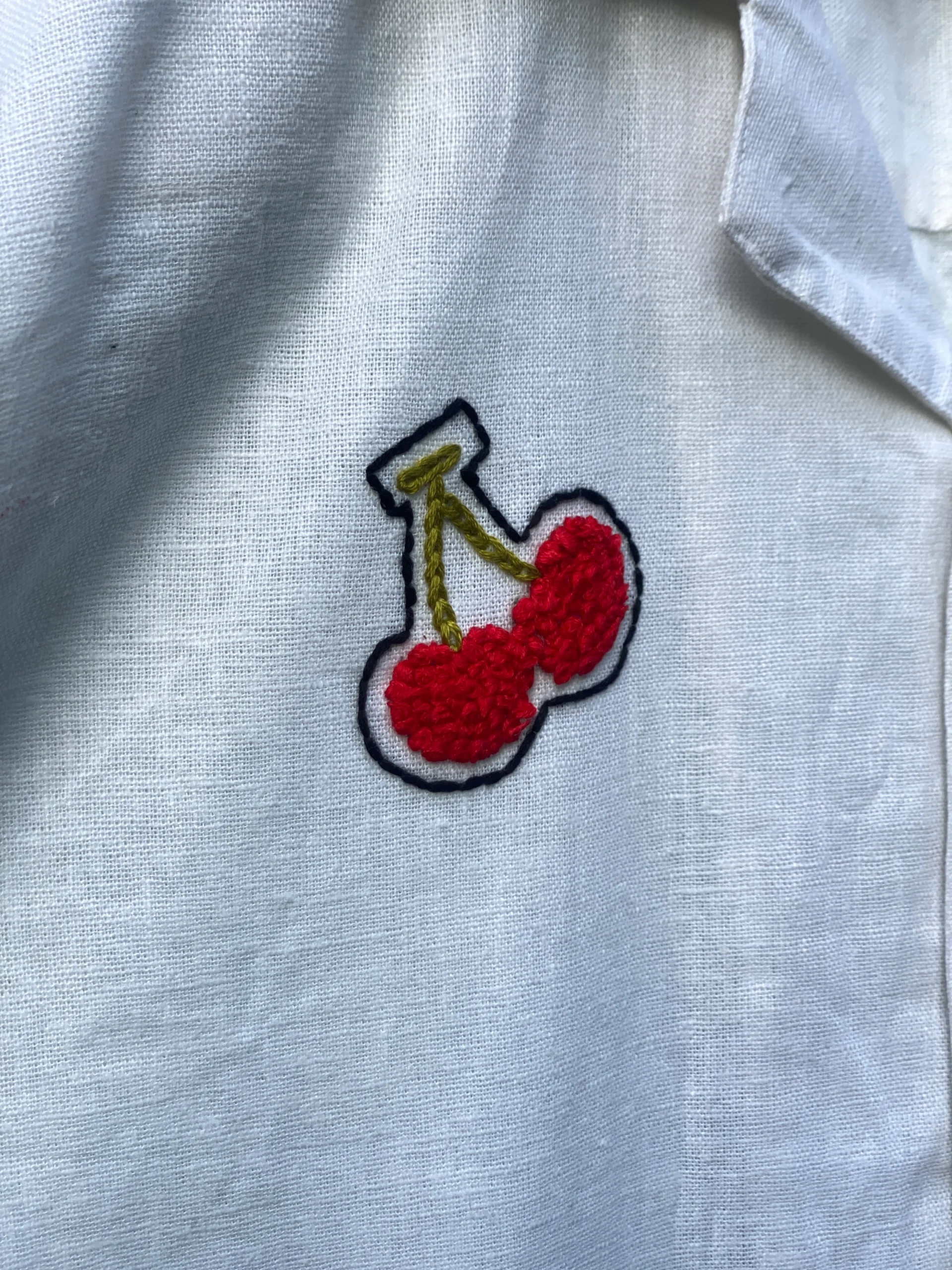 "Handmade linen cotton shirt with colorful hand embroidery including guitar, cherries, cake, and love motifs – limited edition Cuban collar shirt by Liibula"