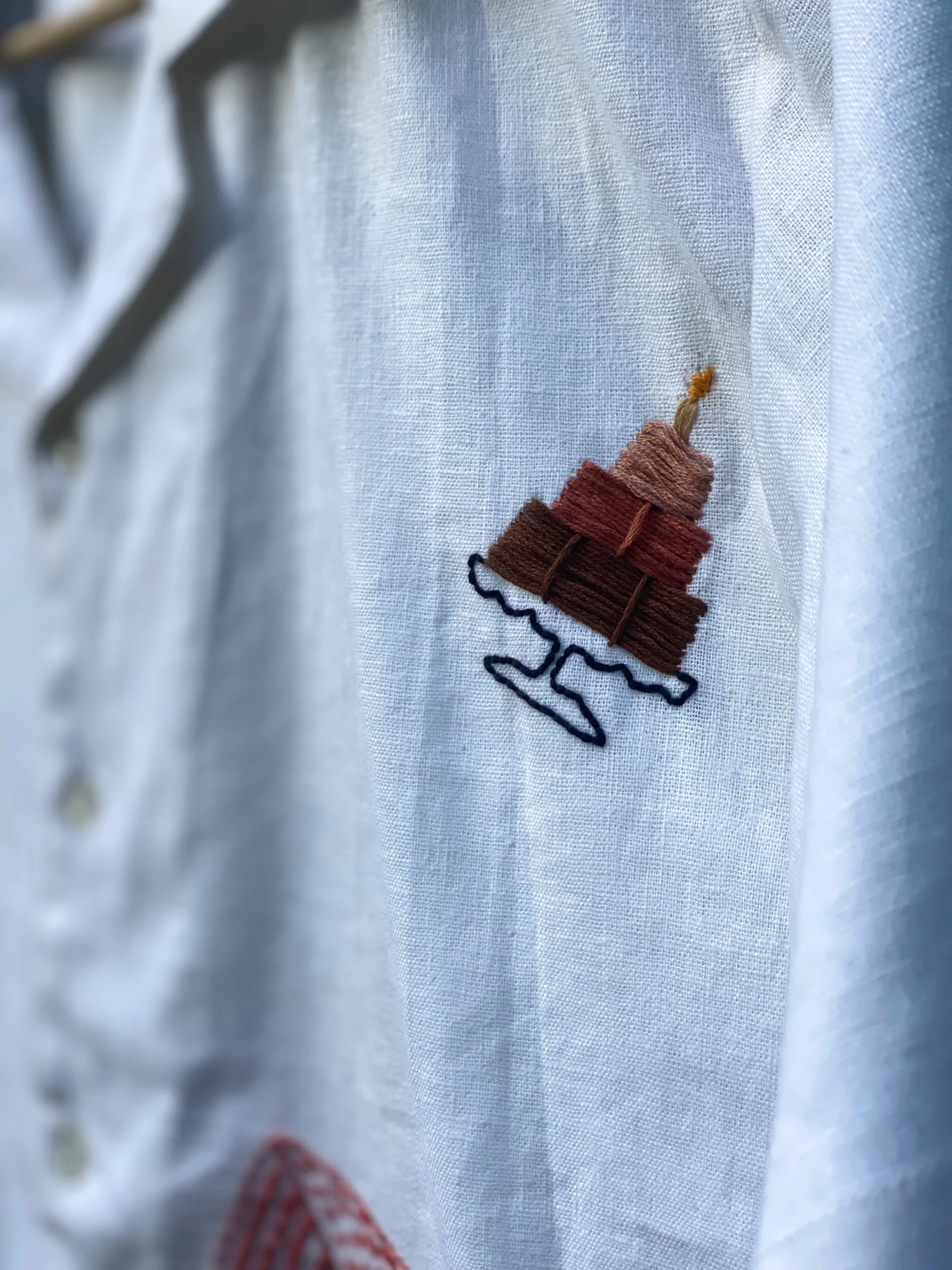 "Handmade linen cotton shirt with colorful hand embroidery including guitar, cherries, cake, and love motifs – limited edition Cuban collar shirt by Liibula"