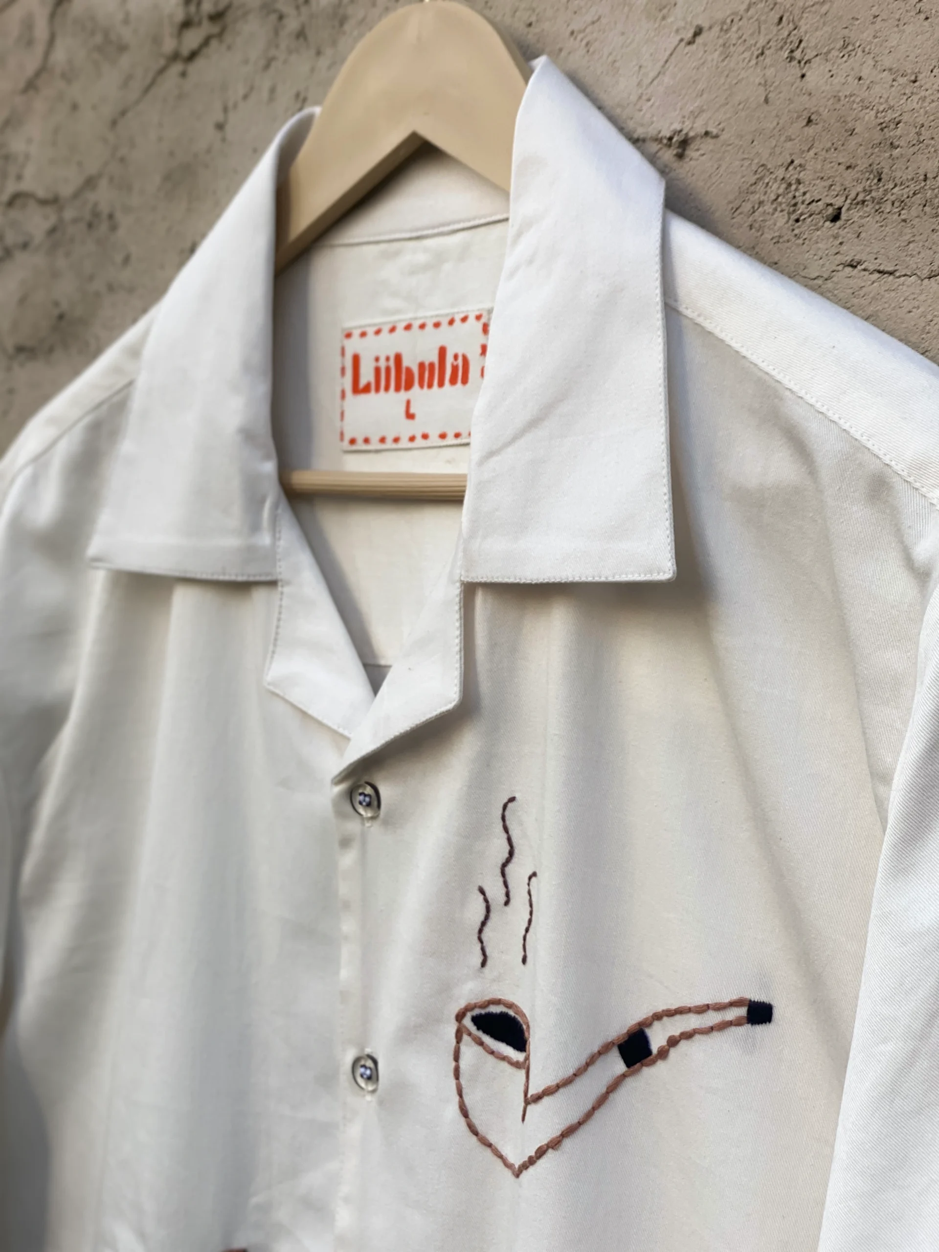 Handmade 100% cotton Cuban-collar shirt with cowboy-themed embroidery including horse, hat, boots, and pipe