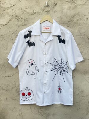 Hand-embroidered ghost figure on white Halloween shirt