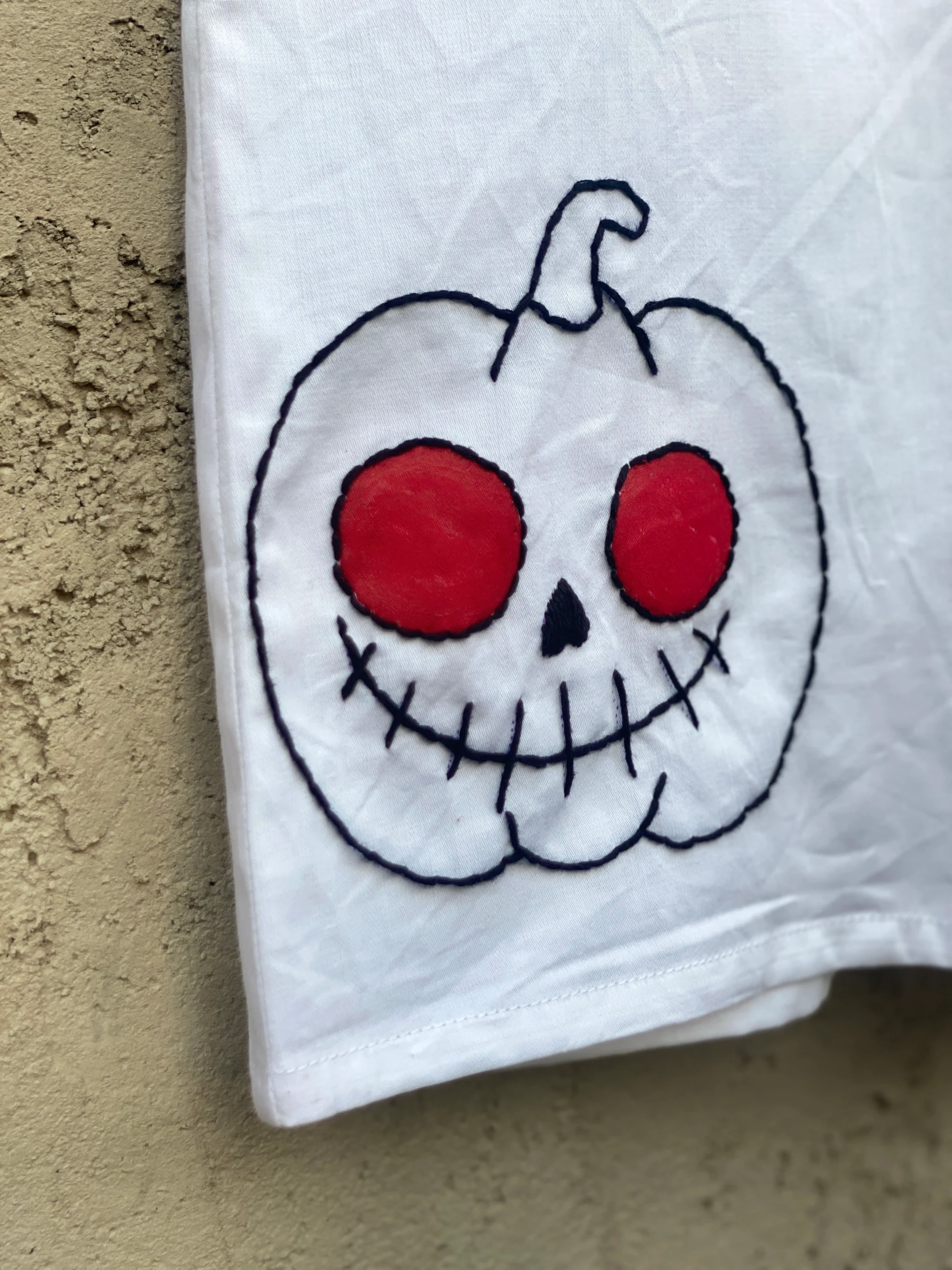 Handmade Halloween shirt featuring spooky embroidery designs