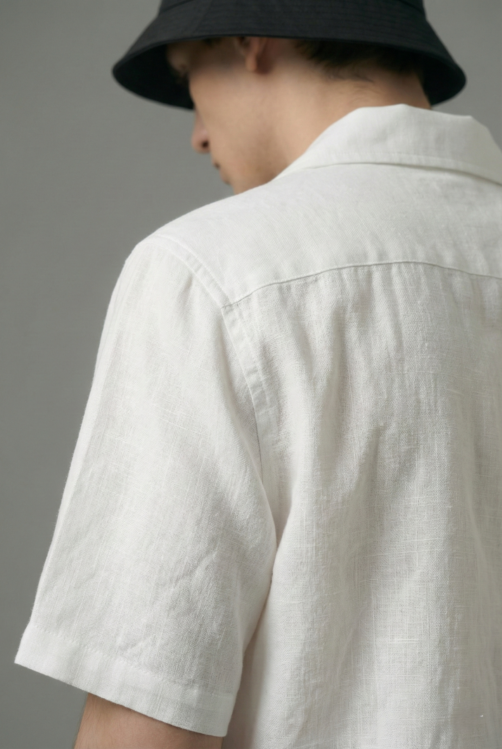 close up white linen cotton shirt texture back side, breathable fabric detail, premium handmade summer shirt men USA