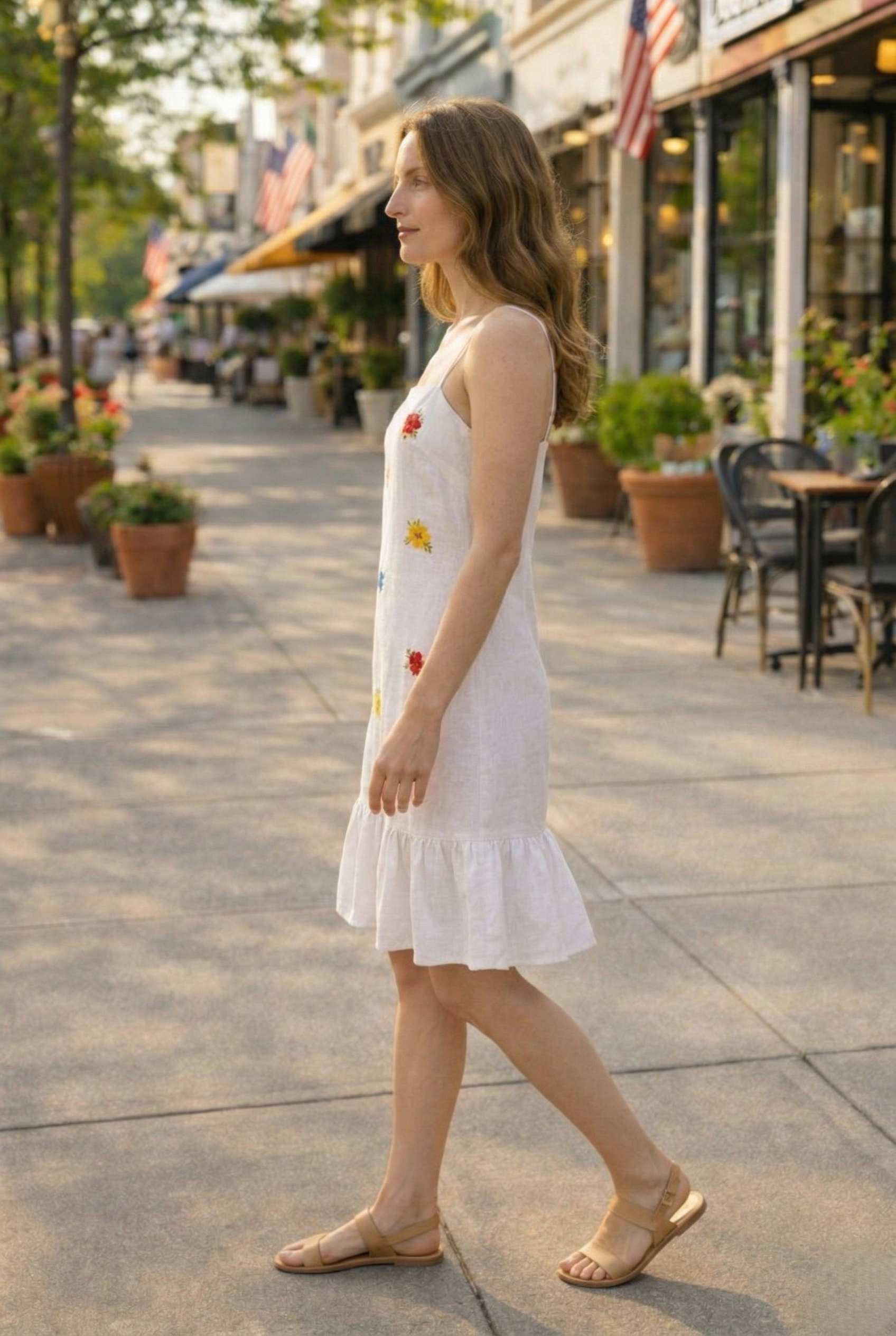 Side view of minimal floral embroidered summer dress lightweight outfit