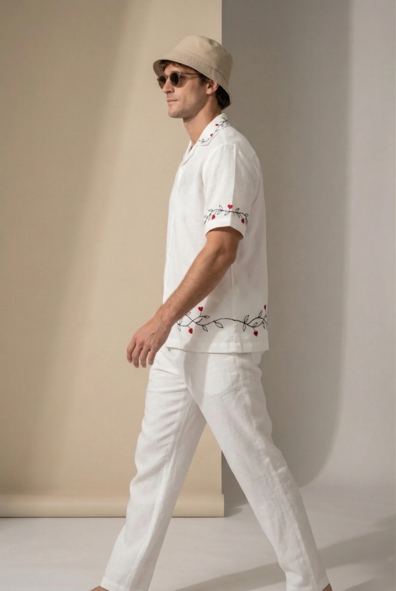 Men white linen shirt side walking pose with red heart embroidery on sleeves and hem, breathable summer vacation outfit, luxury casual wear