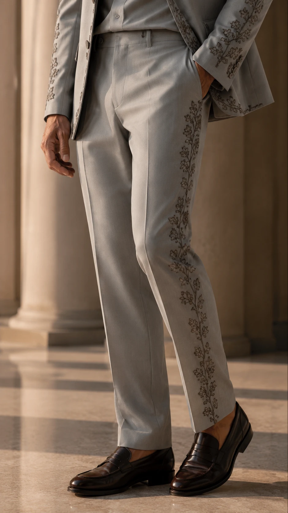 Shop a luxury grey embroidered men’s suit in premium TR Viscose with high-density floral Resham embroidery. Made to order for weddings and special occasions.