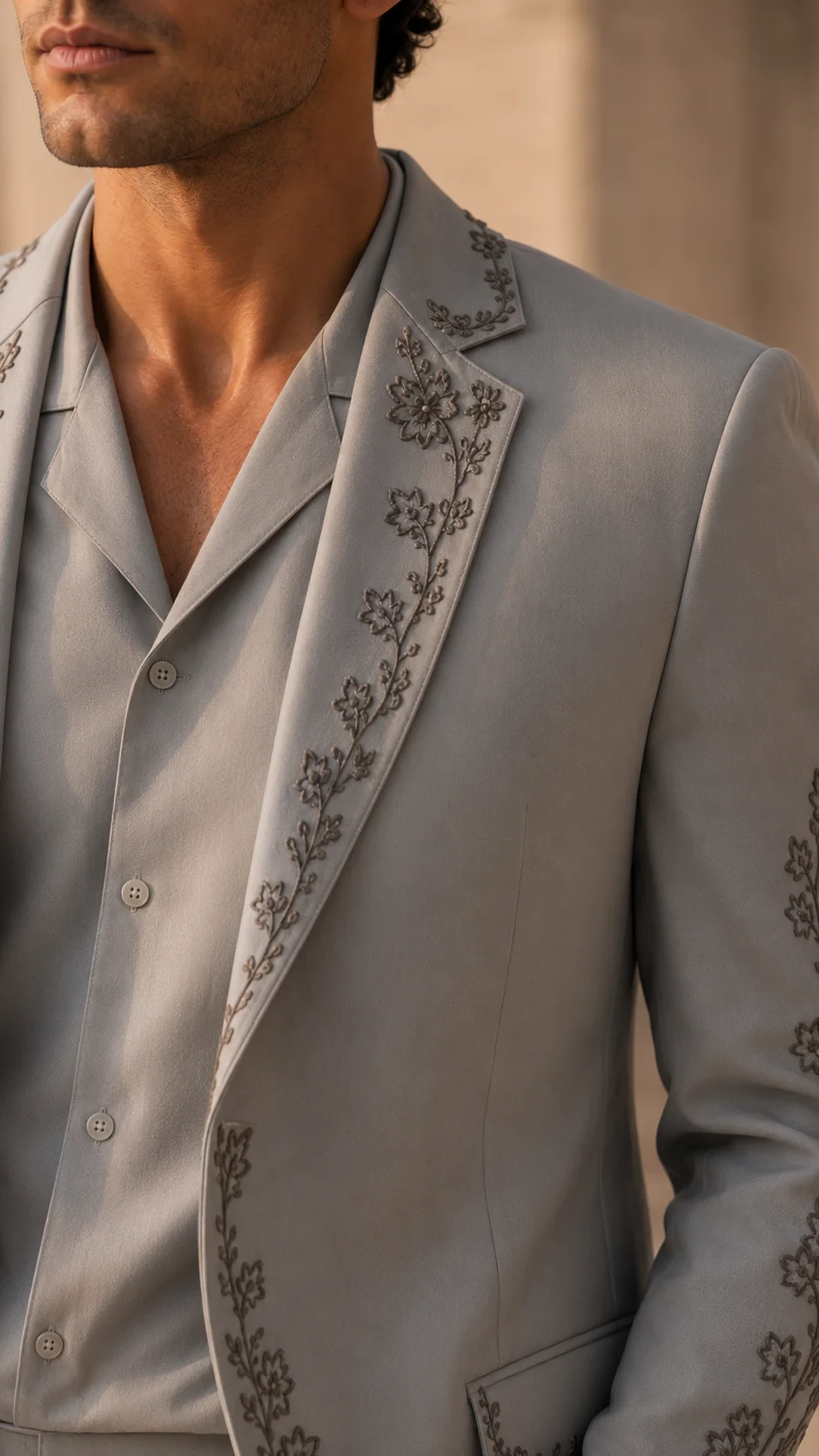 Shop a luxury grey embroidered men’s suit in premium TR Viscose with high-density floral Resham embroidery. Made to order for weddings and special occasions.